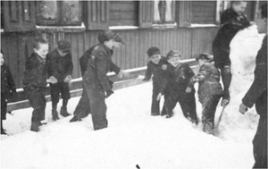 Children play in the snow, Lodz ghetto, Poland<