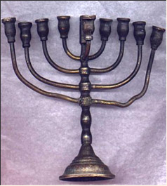 Hanukkah Lamp, presented as a present to the head of the Lodz Ghetto Judenrat, Rumkowski, by the manager of the ghetto paper factory. 